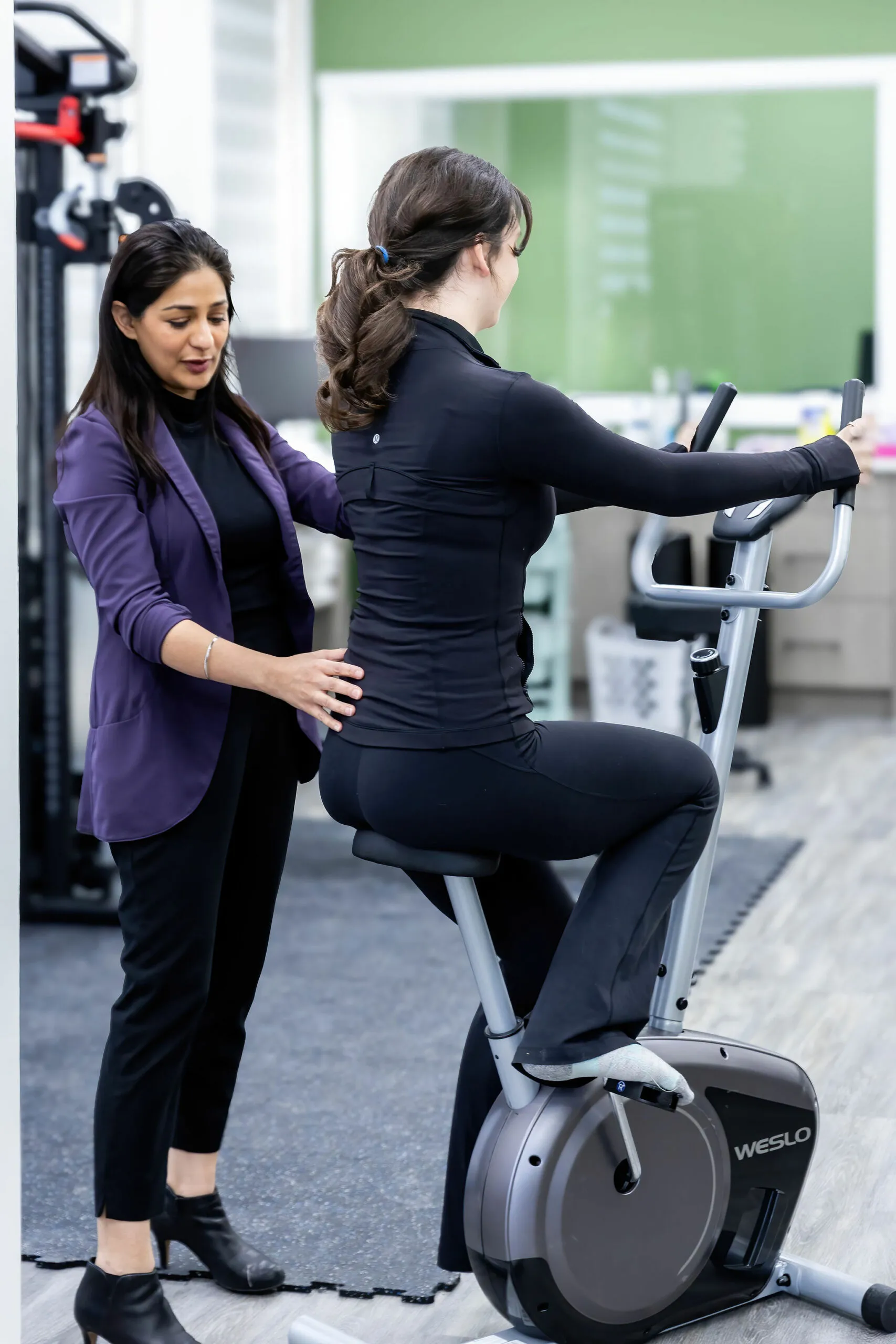 Anant guiding a supervised exercise session at Physio Studio Health